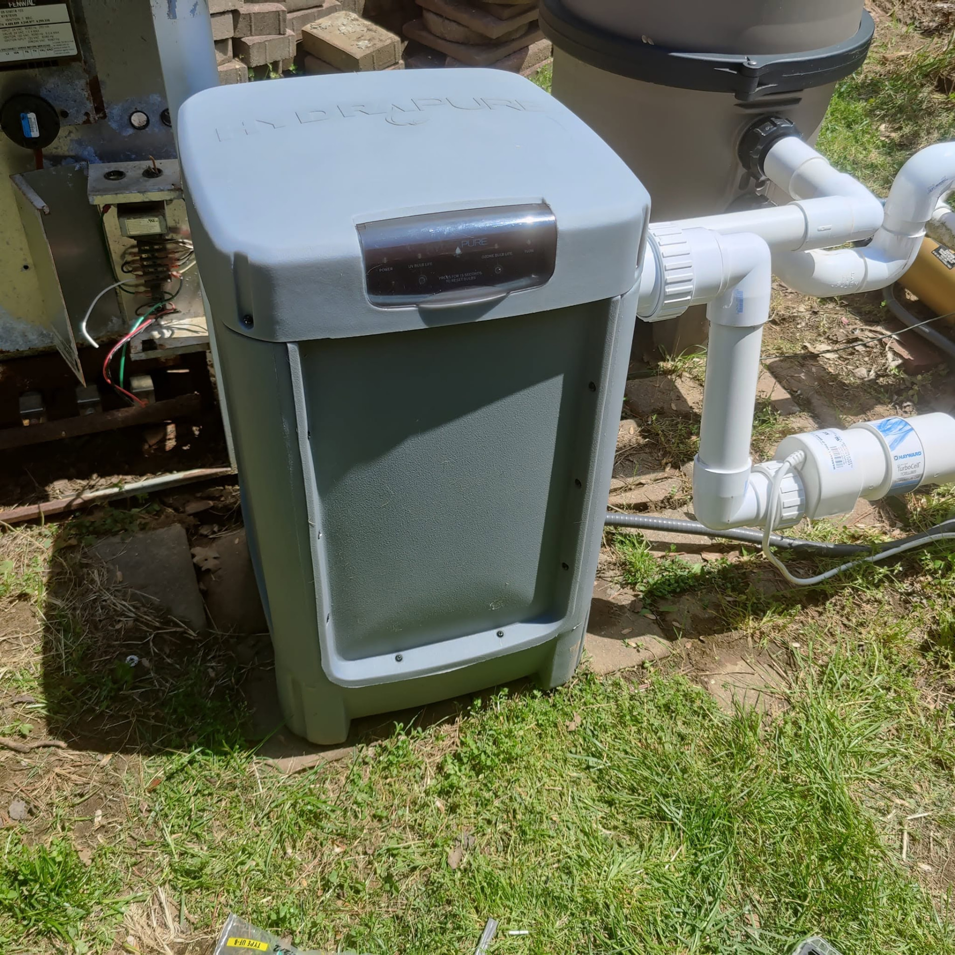 HydraPure UV/ozone unit installed beside a pool heater