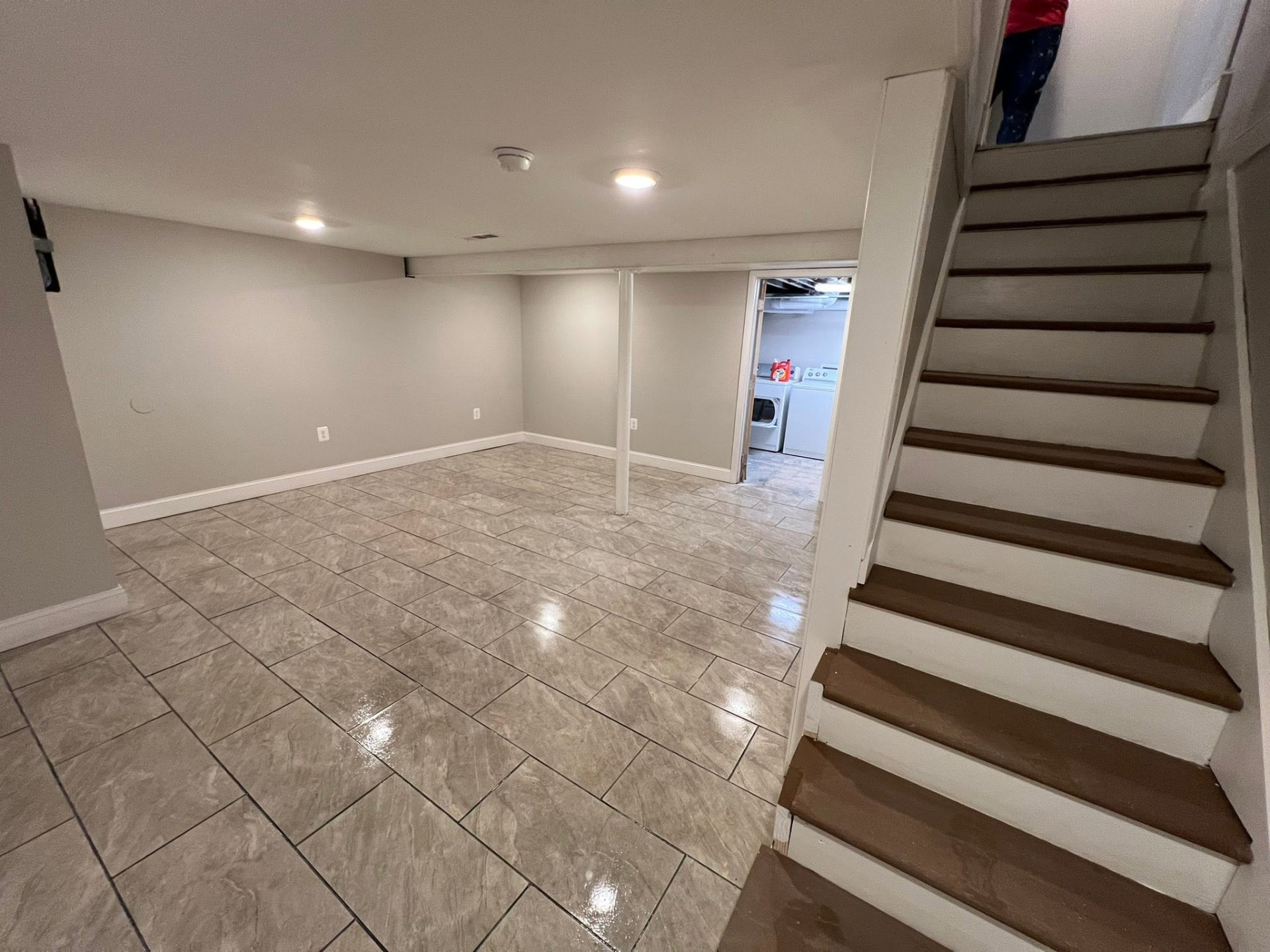 Basement family room opening to the laundry area