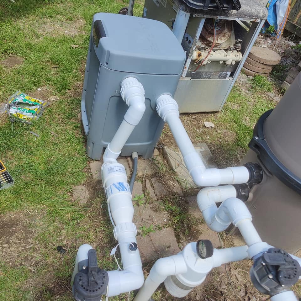 Rebuilt PVC manifold and valves feeding a pool filter