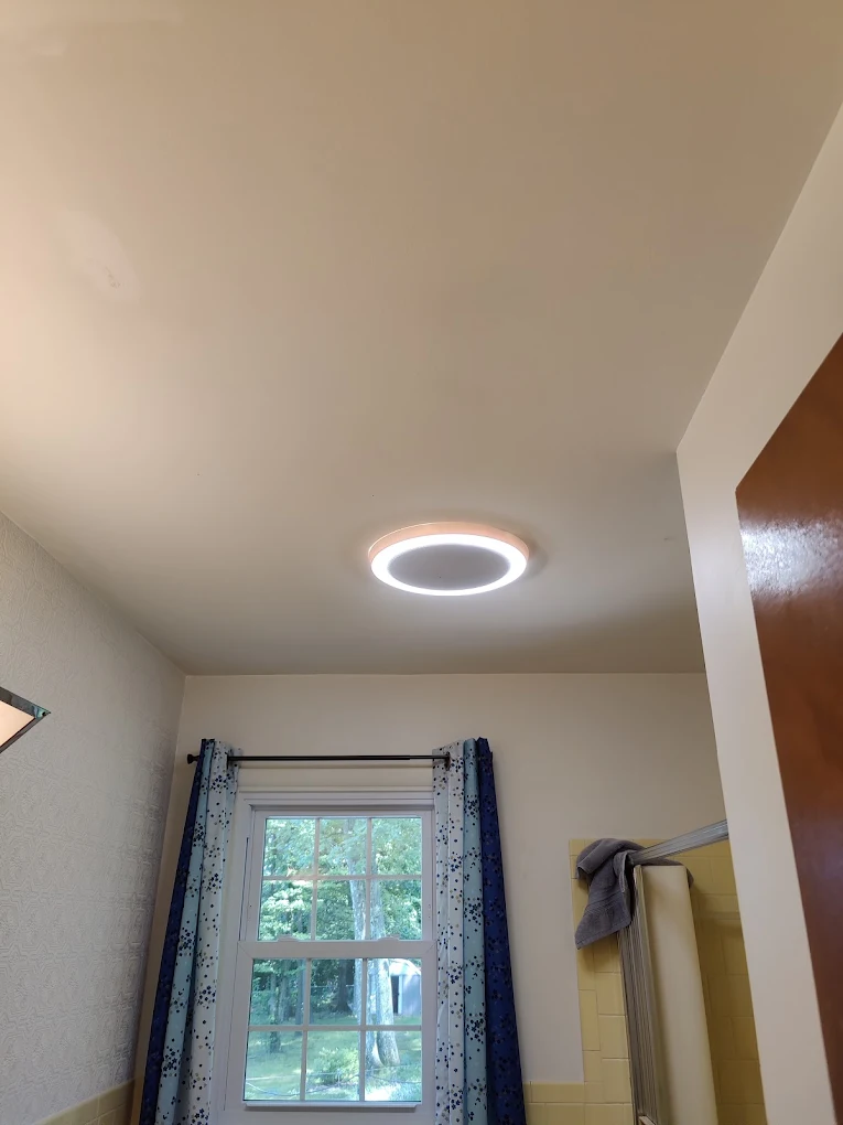 New flush LED ceiling fixture installed in a bathroom