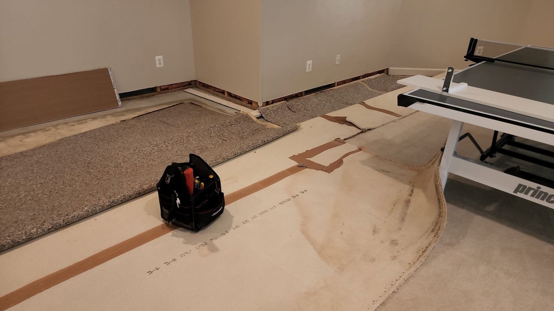 Old carpet and debris staged for removal